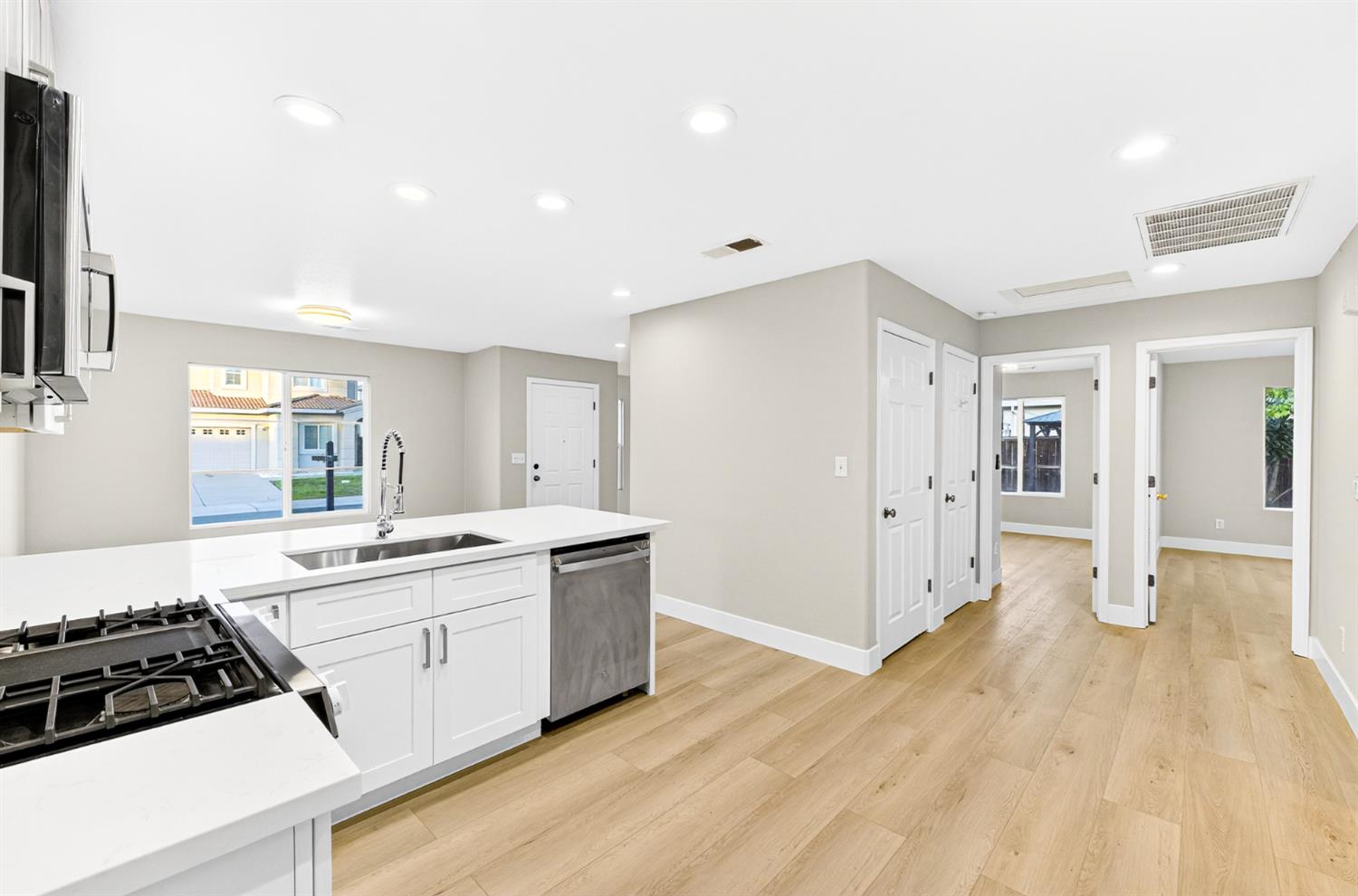 7481 Splendid Way Elk Grove, CA 95758 - Photo 13 of 41 a kitchen with a sink and a stove top oven