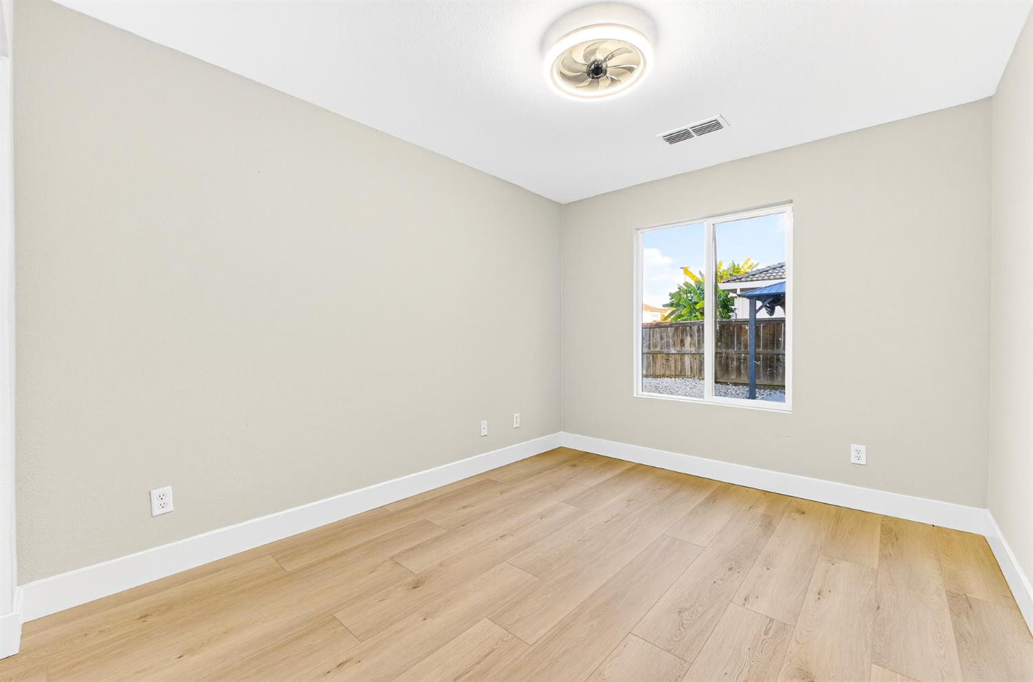 7481 Splendid Way Elk Grove, CA 95758 - Photo 25 of 41 an empty room with a window