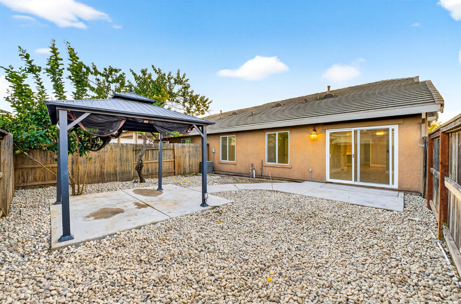 7481 Splendid Way Elk Grove, CA 95758 - Photo 34 of 41 a backyard of a house with a table and chairs