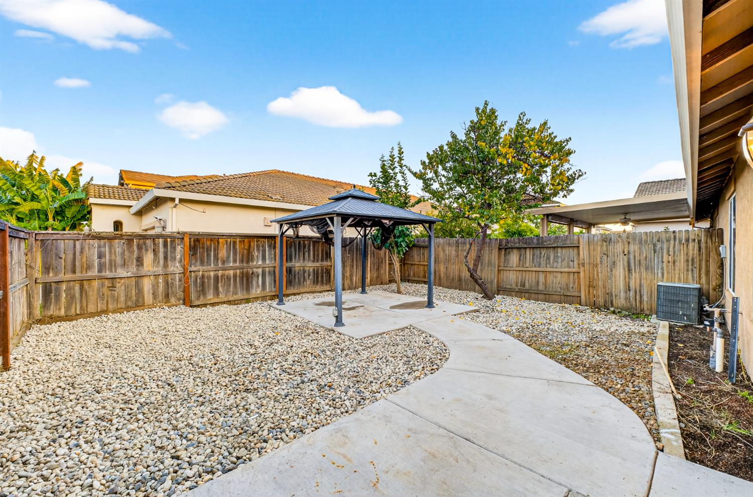 7481 Splendid Way Elk Grove, CA 95758 - Photo 35 of 41 a backyard of a house with table and chairs