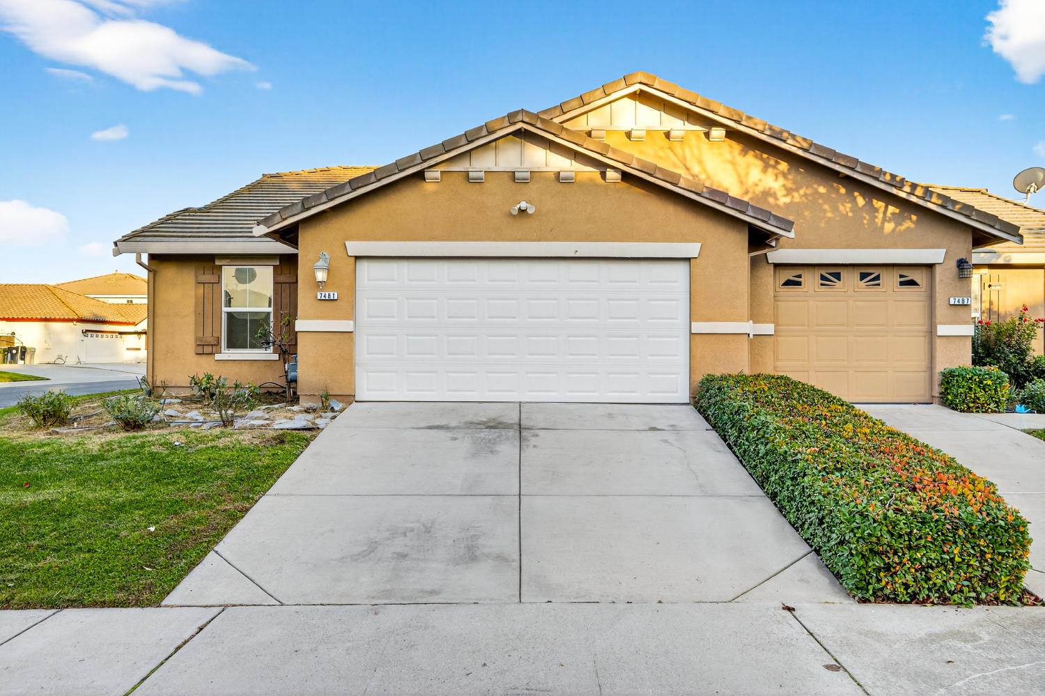 7481 Splendid Way Elk Grove, CA 95758 - Photo 4 of 41 a front view of house with yard