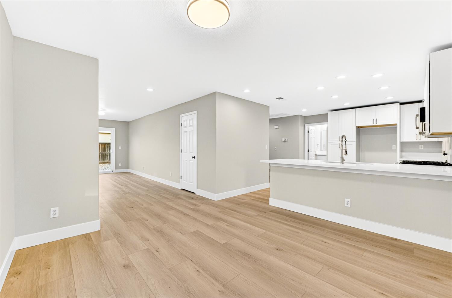 7481 Splendid Way Elk Grove, CA 95758 - Photo 7 of 41 a view of empty room with wooden floor
