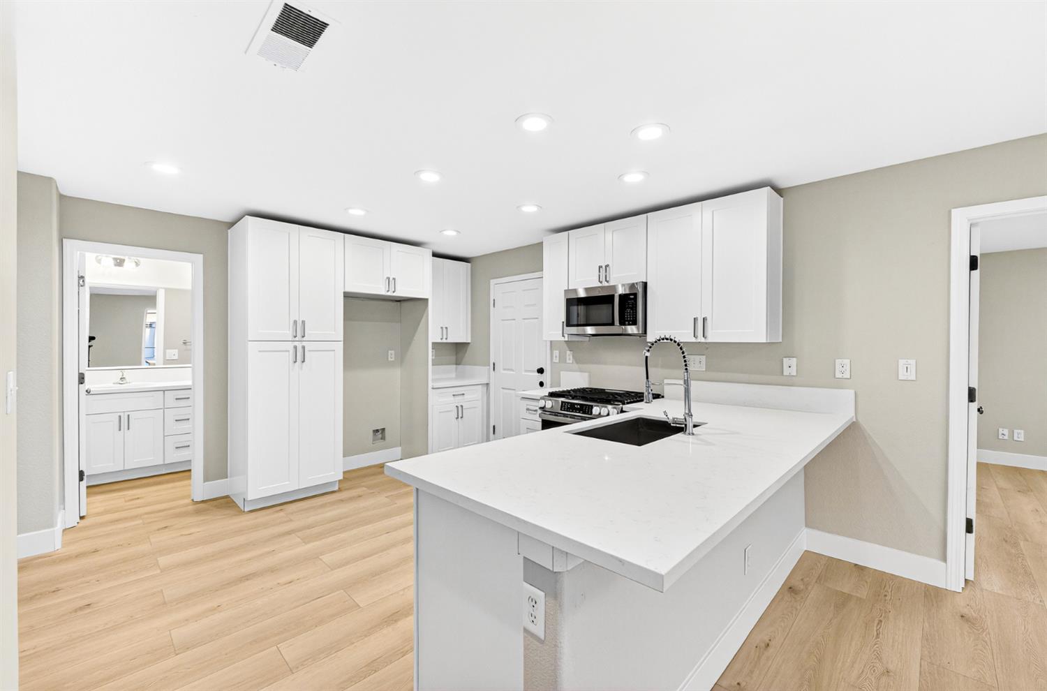 7481 Splendid Way Elk Grove, CA 95758 - Photo 8 of 41 a kitchen with a appliances a sink and a refrigerator