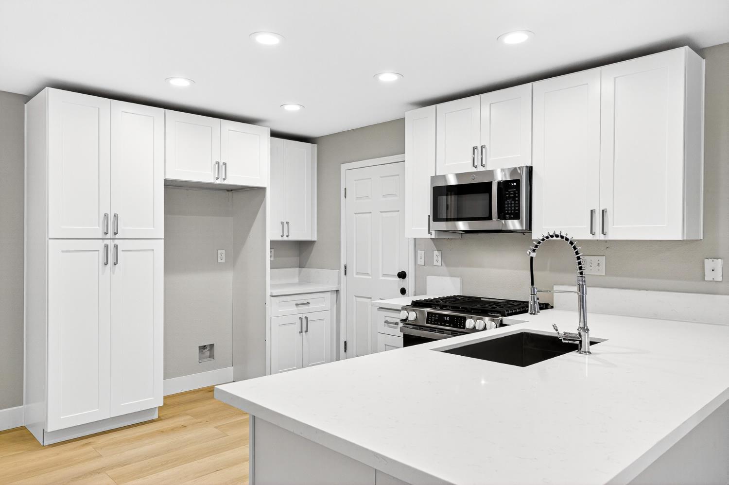 7481 Splendid Way Elk Grove, CA 95758 - Photo 9 of 41 a kitchen with a refrigerator a sink and cabinets