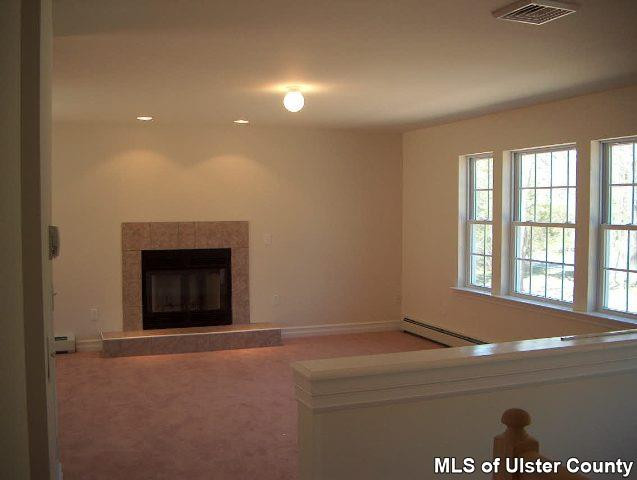 4301 Atwood Road Stone Ridge, NY 12484 - Photo 1 of 3 a room with a fireplace and a window