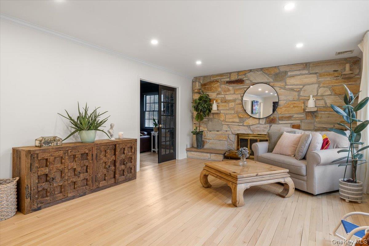 223 Bread And Cheese Hollow Road Northport, NY 11768 - Photo 12 of 32 a living room with furniture and wooden floor