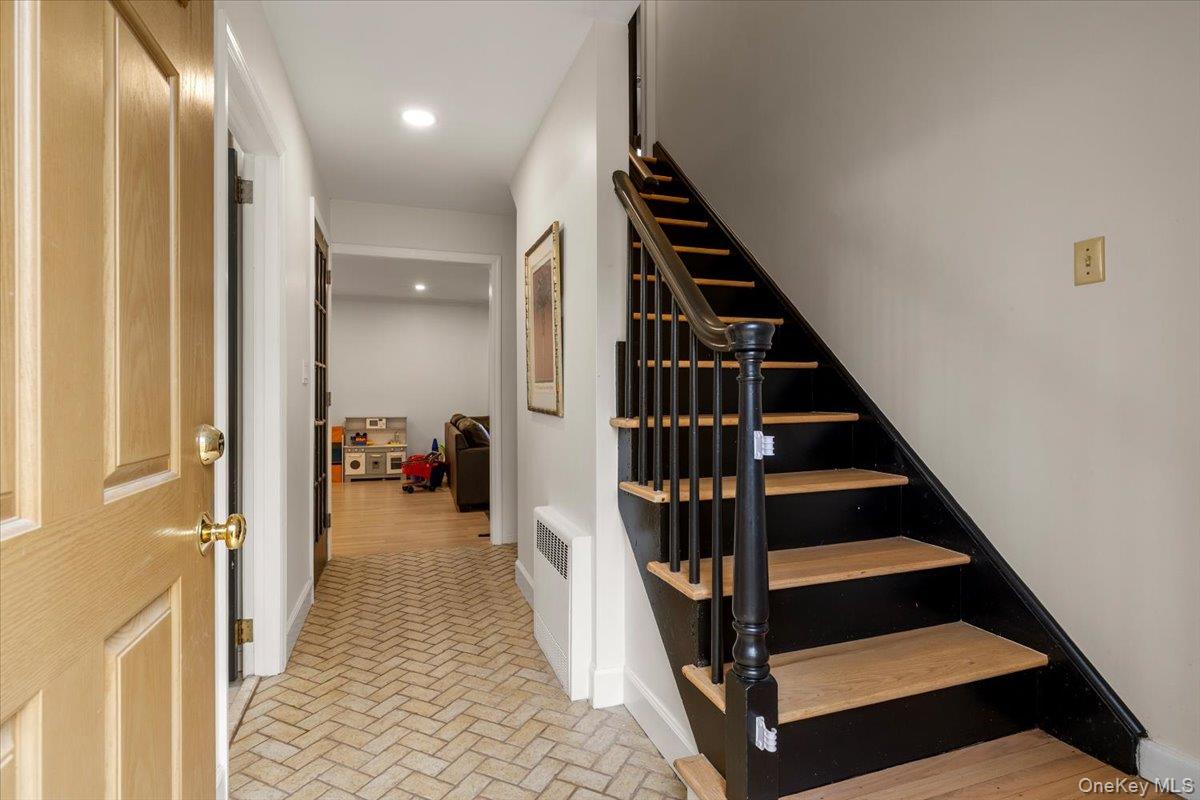 223 Bread And Cheese Hollow Road Northport, NY 11768 - Photo 18 of 32 a view of entryway and hall with wooden floor