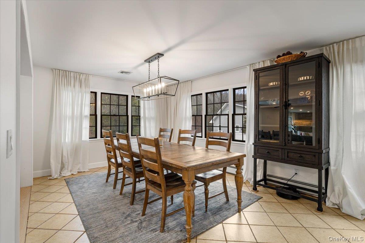 223 Bread And Cheese Hollow Road Northport, NY 11768 - Photo 8 of 32 a view of a dining room with furniture