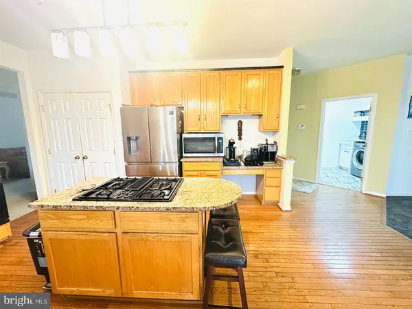 a living room with furniture and large windows
