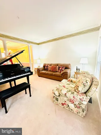 a living room with furniture and a rug