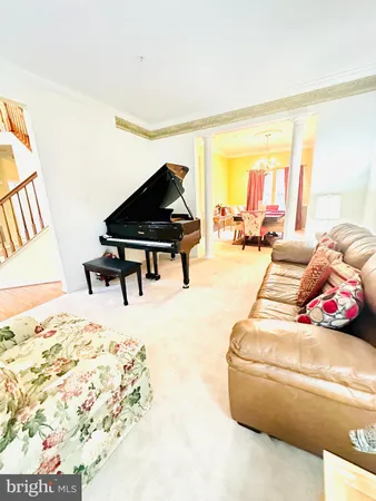 a living room with furniture and rug floor