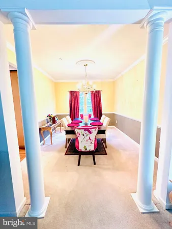 a bed room with a bed mirror and a night stand