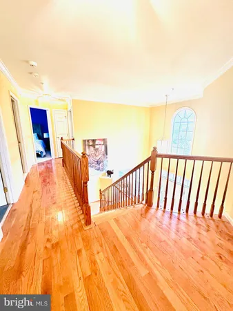 a spacious bedroom with a bed and a night stand
