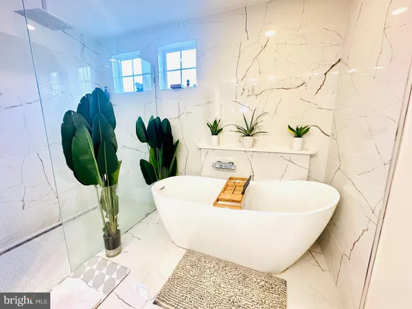 a bathroom with a toilet and a mirror