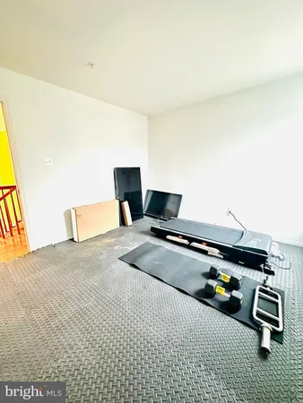 a bathroom with a shower curtain and a mirror