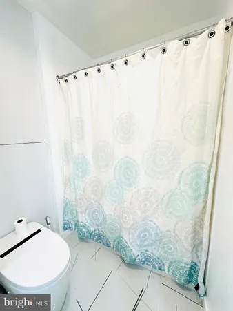 a bathroom with a sink double vanity granite and a mirror
