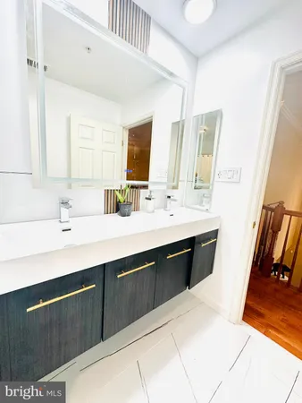 a bedroom with a bed and a night stand