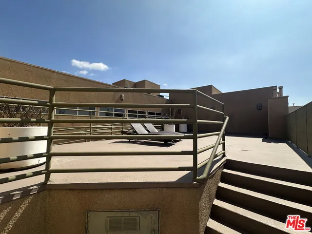 a view of a terrace with chairs