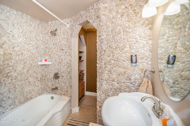 a bathroom with a sink and a bathtub