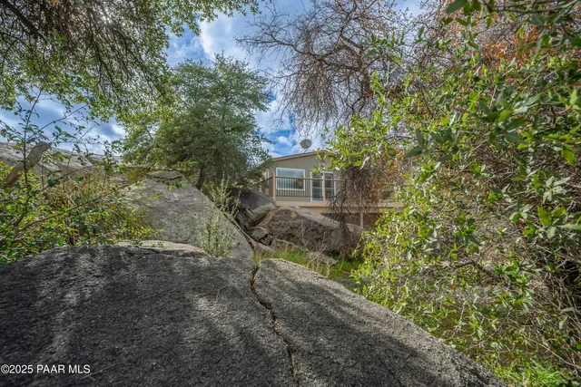 a backyard of a house with lots of green space