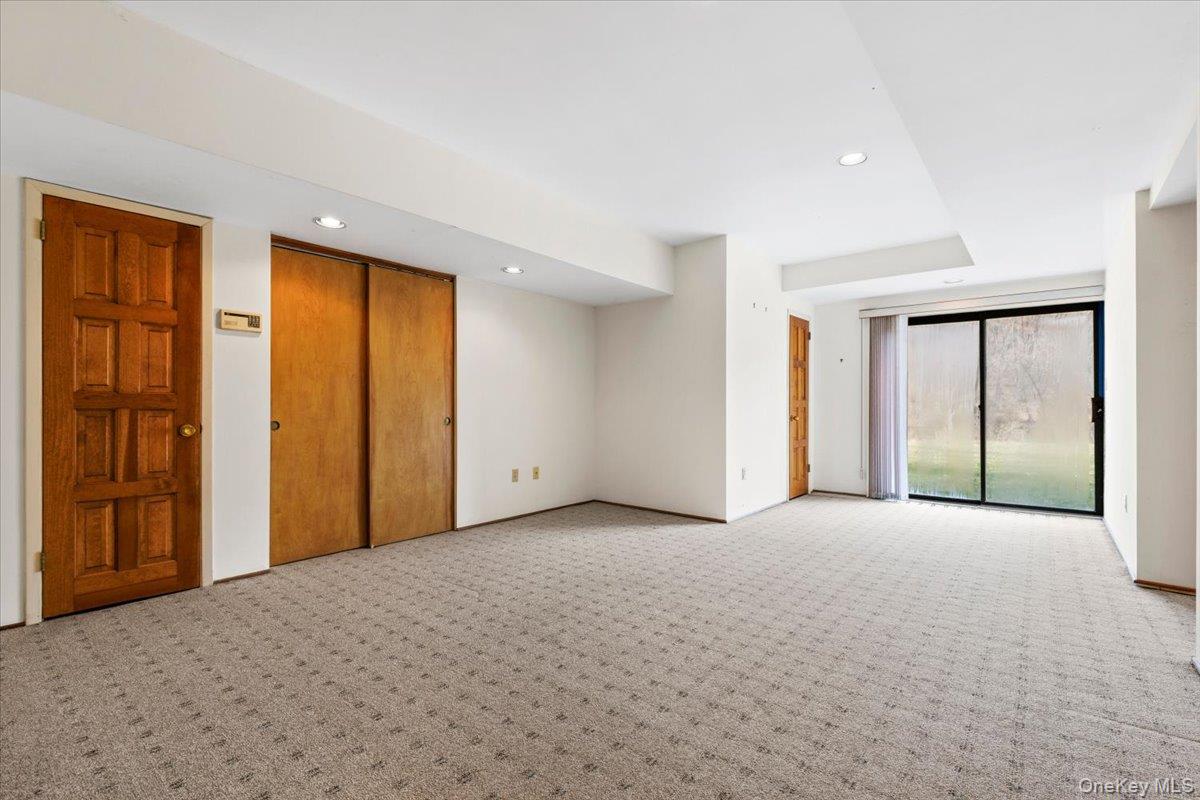 88 Farm Lake Cres Road Chappaqua, NY 10514 - Photo 15 of 22 a view of an empty room with a window