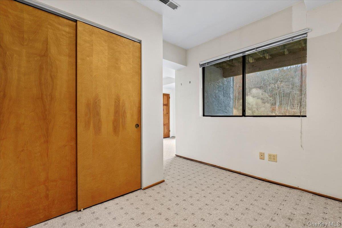 88 Farm Lake Cres Road Chappaqua, NY 10514 - Photo 17 of 22 a view of a small space with wooden floor and a window