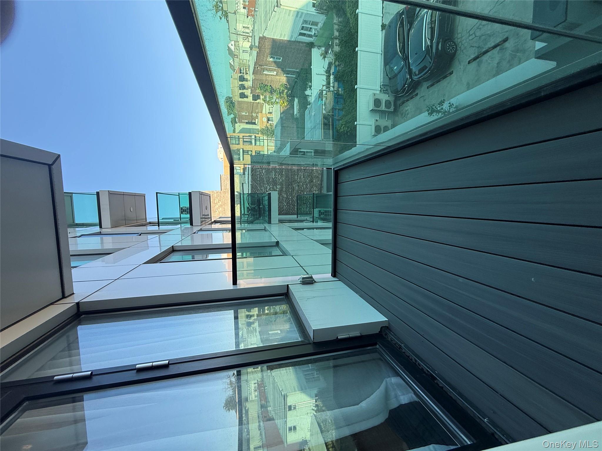 32-58 105th Street, Unit 4A Queens, NY 11369 - Photo 8 of 8 a view of balcony with wooden floor