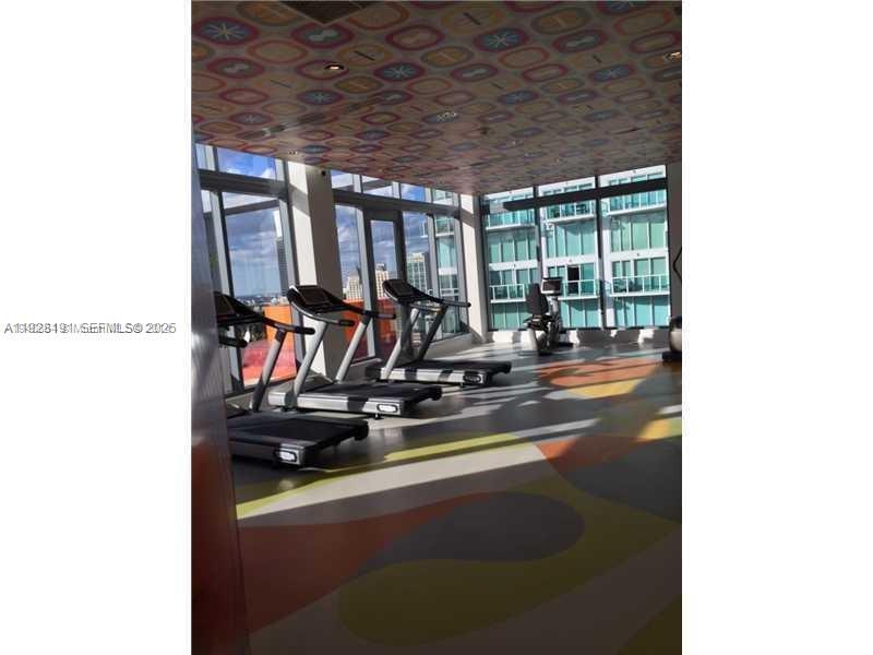31 Southeast 6th Street, Unit 1804 Miami, FL 33131 - Photo 12 of 15 a view of a room with gym equipment