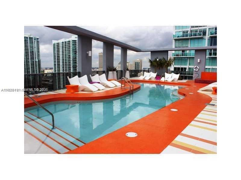 31 Southeast 6th Street, Unit 1804 Miami, FL 33131 - Photo 15 of 15 a outdoor space with a patio and swimming pool