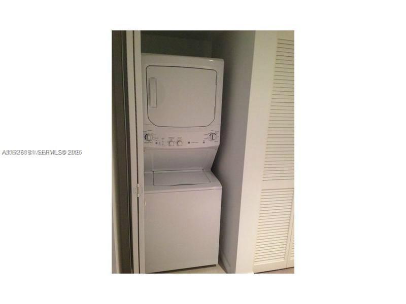 31 Southeast 6th Street, Unit 1804 Miami, FL 33131 - Photo 10 of 15 a utility room with a toilet and a sink