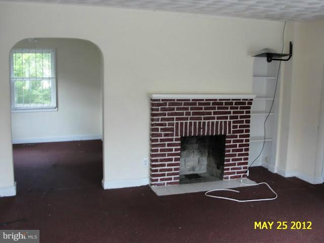 9214 Annapolis Road Lanham, MD 20706 - Photo 14 of 30 a view of livingroom with furniture and a fireplace
