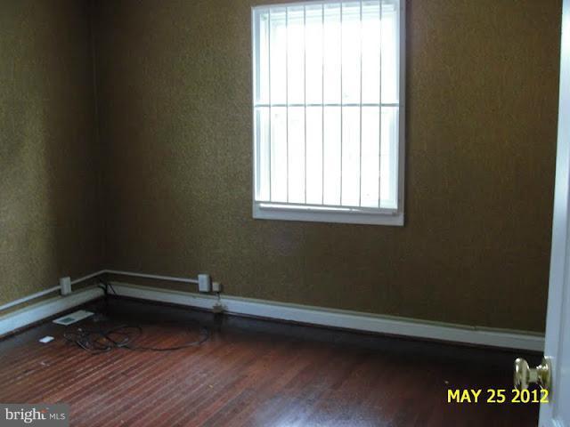 9214 Annapolis Road Lanham, MD 20706 - Photo 18 of 30 a view of a room with wooden floor and a window