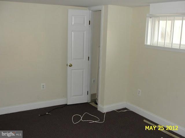 9214 Annapolis Road Lanham, MD 20706 - Photo 19 of 30 an empty room with a door