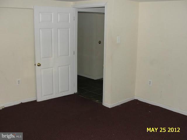 9214 Annapolis Road Lanham, MD 20706 - Photo 21 of 30 an empty room with wooden floor