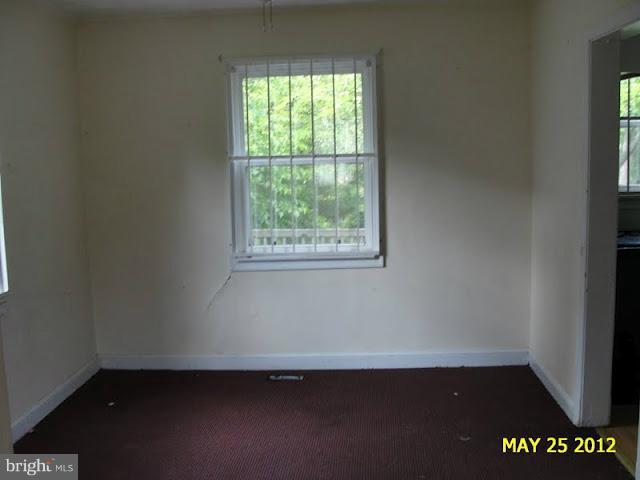 9214 Annapolis Road Lanham, MD 20706 - Photo 25 of 30 an empty room with a window