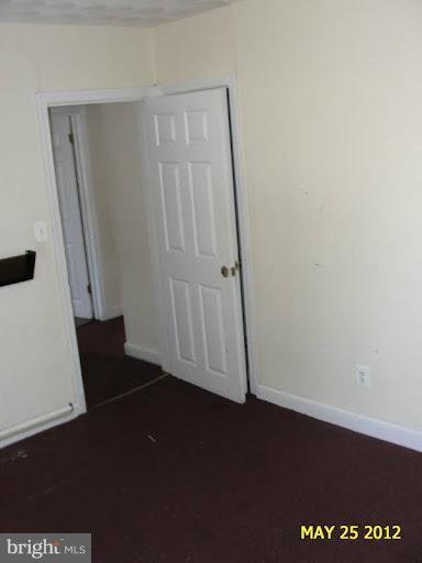 9214 Annapolis Road Lanham, MD 20706 - Photo 26 of 30 an empty room with wooden floor