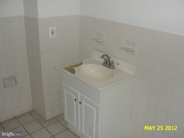 9214 Annapolis Road Lanham, MD 20706 - Photo 27 of 30 a bathroom with a sink and a vanity