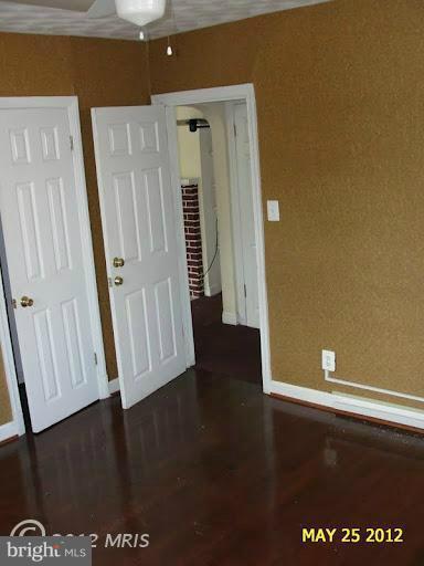 9214 Annapolis Road Lanham, MD 20706 - Photo 7 of 30 a view of empty room with wooden floor