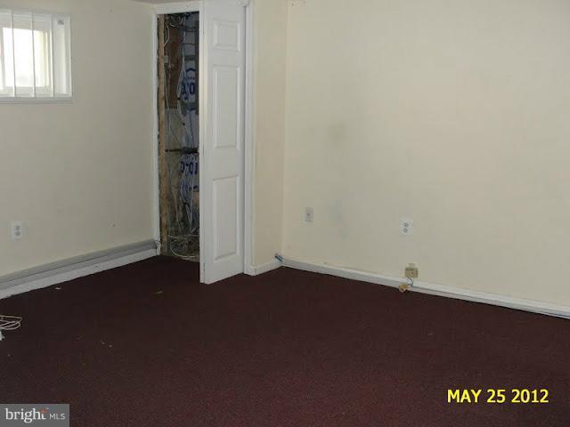 9214 Annapolis Road Lanham, MD 20706 - Photo 8 of 30 an empty room with a door