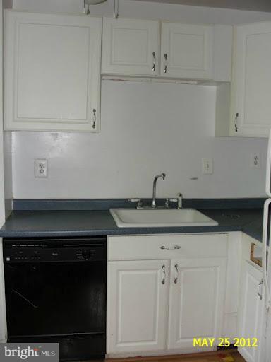 9214 Annapolis Road Lanham, MD 20706 - Photo 9 of 30 a kitchen with a sink and cabinets