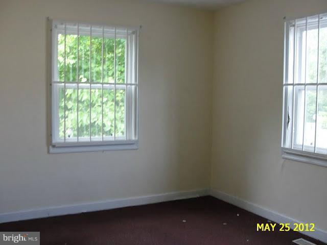 9214 Annapolis Road Lanham, MD 20706 - Photo 10 of 30 an empty room with a window