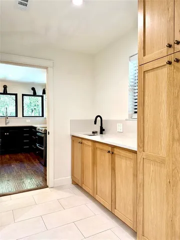 a view of a kitchen from the hallway