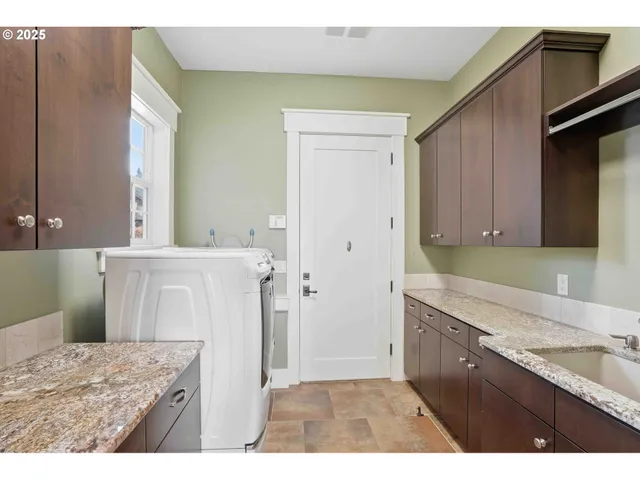 a bathroom with a granite countertop sink a vanity and a mirror