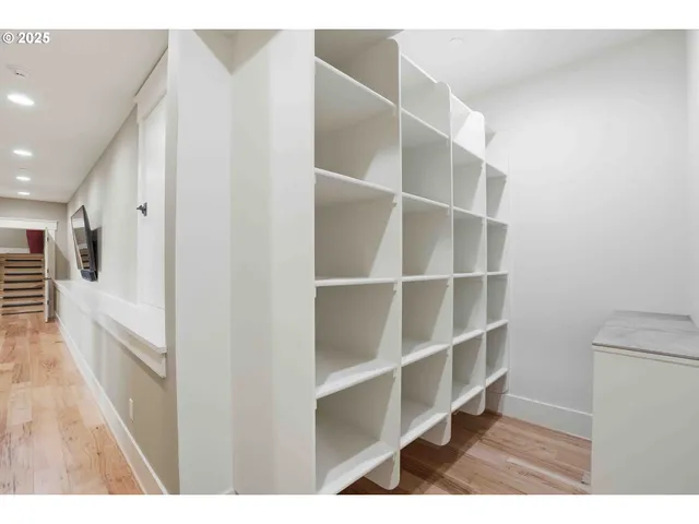 a view of a living room with a wooden floor