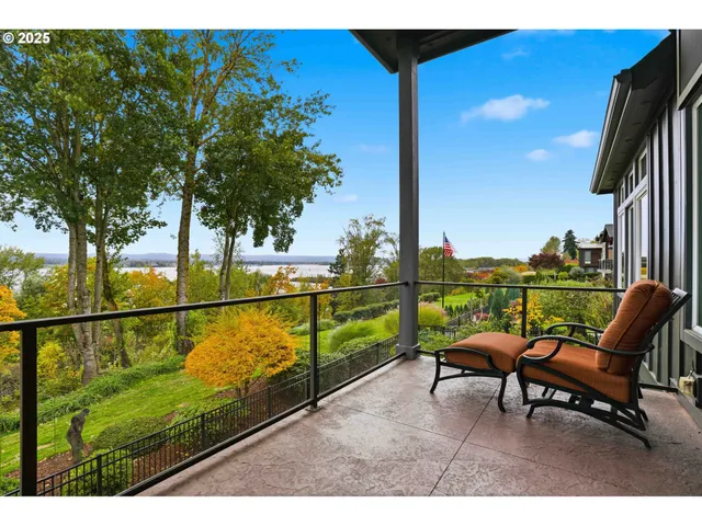 a view of a balcony with chairs