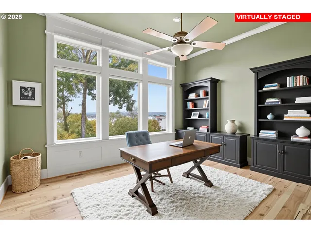 a workspace with furniture window and wooden floor