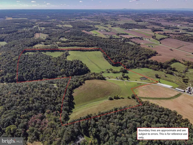 a white toilet sitting next to a shower