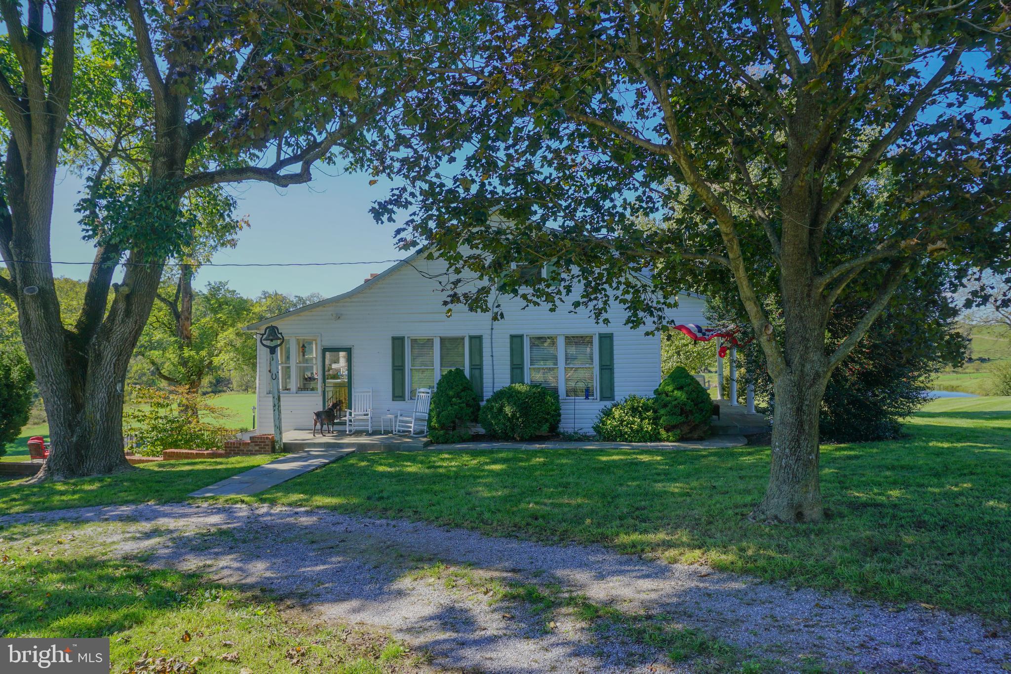 4205 Sams Creek Road New Windsor, MD 21776 - Photo 16 of 103 a front view of a house with a garden