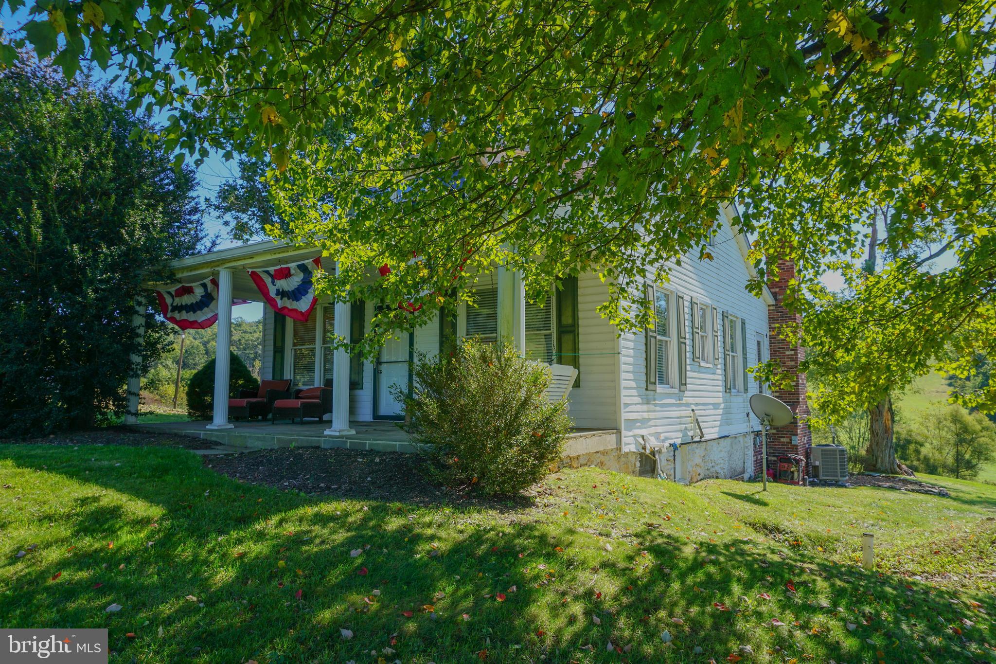 4205 Sams Creek Road New Windsor, MD 21776 - Photo 18 of 103 a view of a house with a tree in a yard