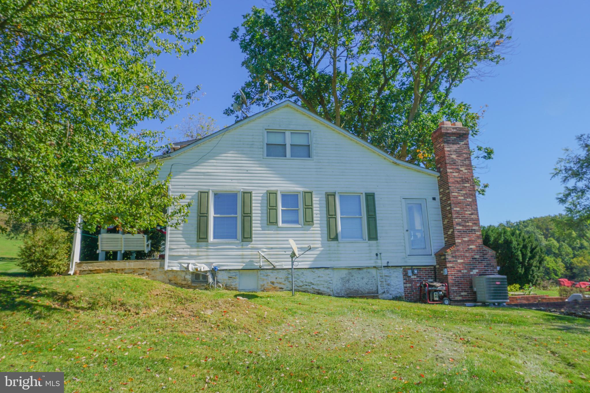 4205 Sams Creek Road New Windsor, MD 21776 - Photo 19 of 103 a front view of house with yard and green space